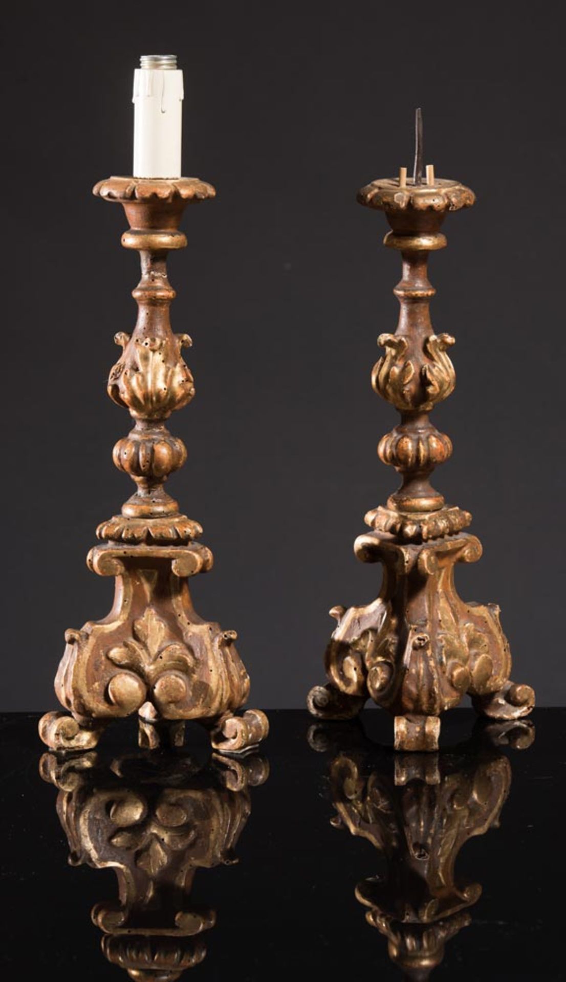 Pair of carved, lacquered and gilt wood candlestick, 18th Century.