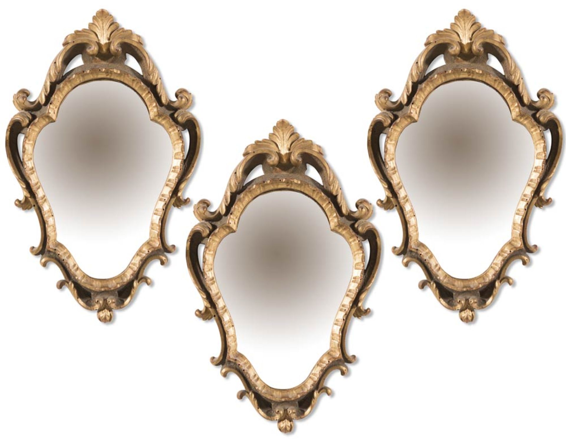 Three carved, partially lacquered ad gilt wood small mirrors, early 20th Century.