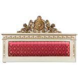 Lacquered wood bed head with carved and giltwood frieze, 20th Century.