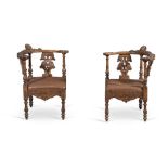 Pair of walnut corner chairs, 20th Century.