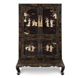 Black laquered and carved cabinet with mother-of-pearl and ivory decorations, China, 20th Century.