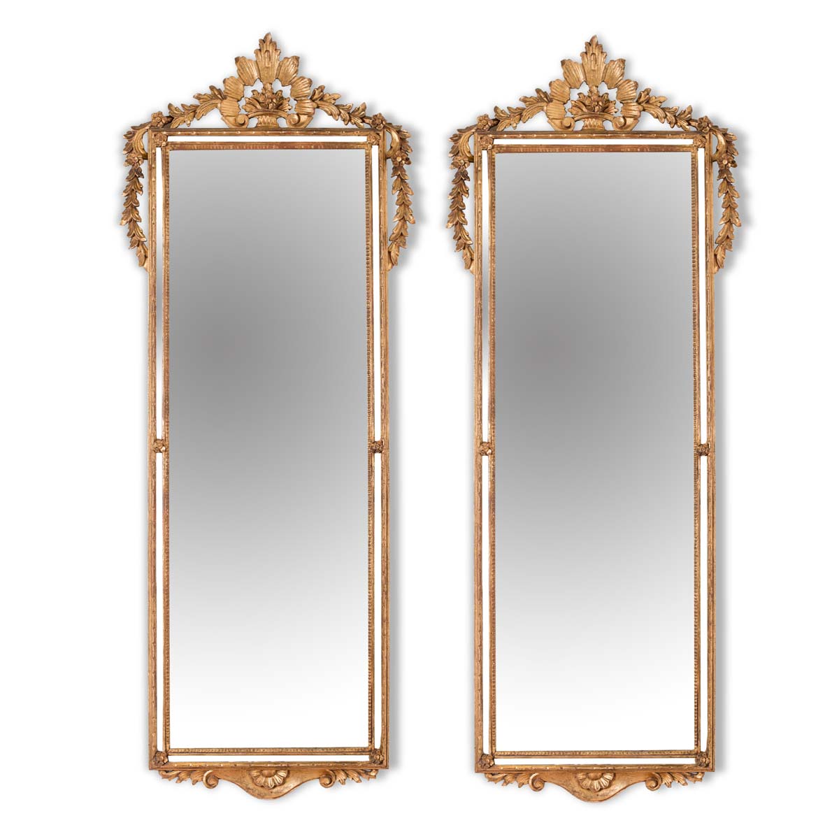 Pair of carved and gilt wood mirrors, 20th Century.