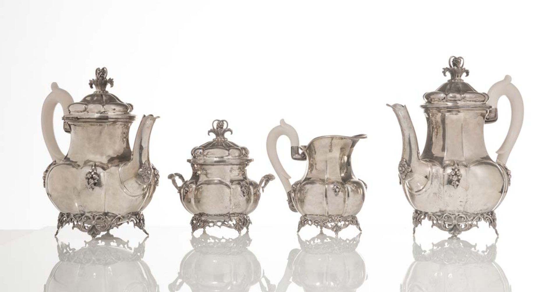 Silver and ivory Tea Service with coffee pot, tea pot, covered sugar and creamer, Italy.