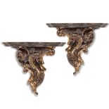 Pair of carved and partially gilt wood shelves, 20th Century.