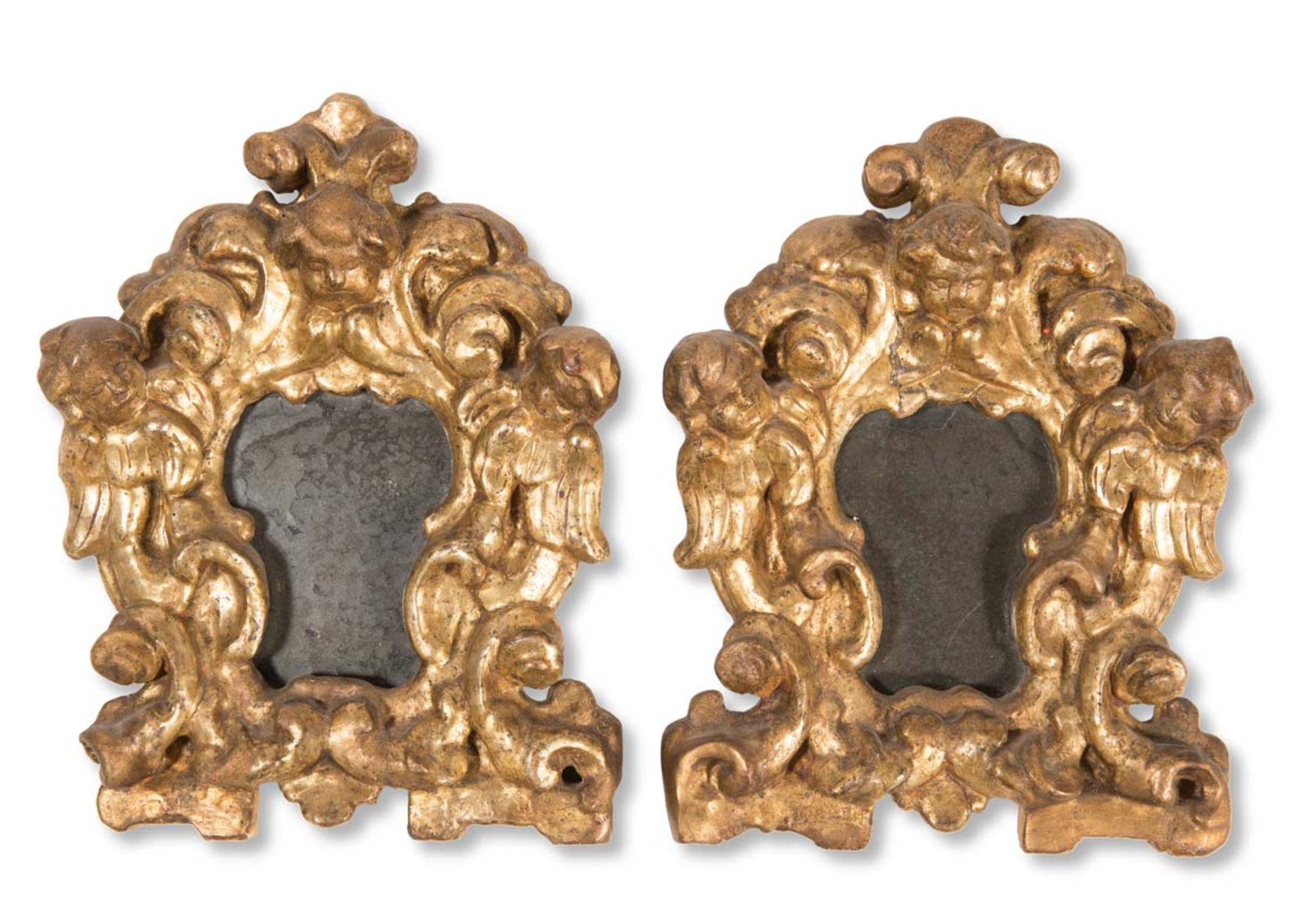Pair of carved and gilt wood mirrors, late 17th Century.