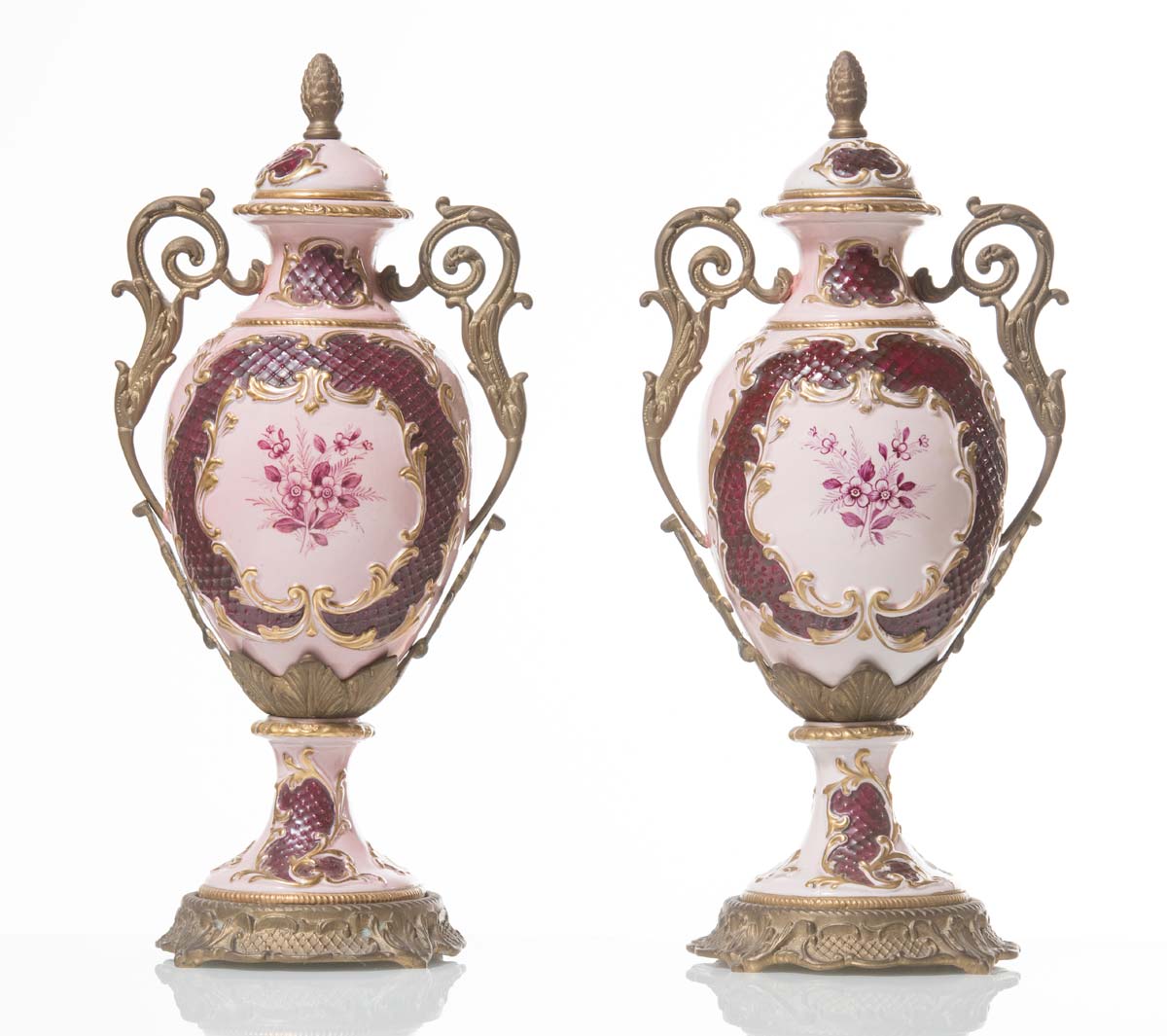 Pair of porcelain and brass-mounted urns, 20th Century.