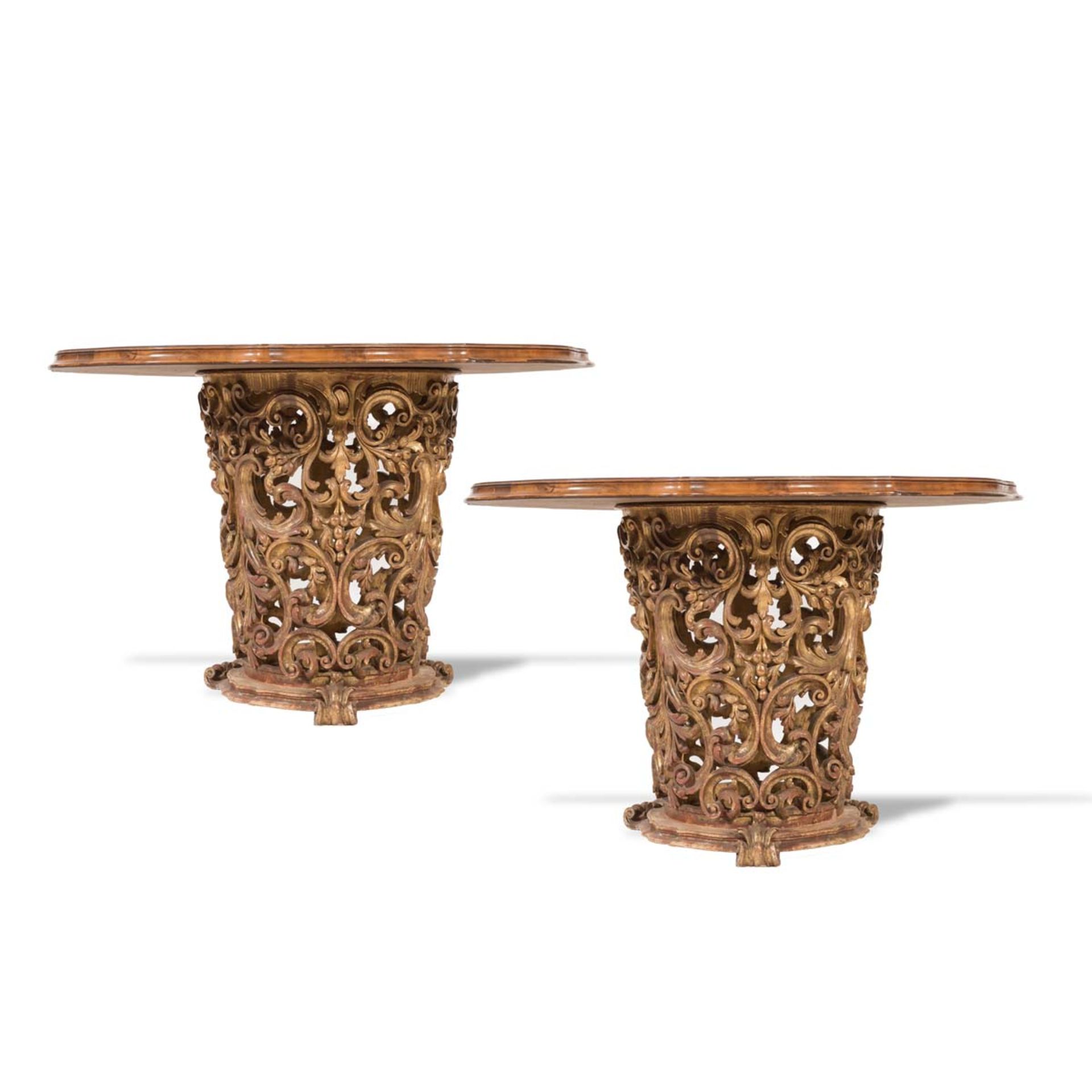 Pair of carved and gilt wood table with round shaped wood top, 20th Century.