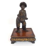 A Japanese bronze figure of a man standing and wearing a straw hat floral kimono and sandals, signed