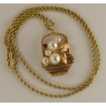 *WITHDRAWN* A 14ct gold basket of flowers pendant set with pearls and rubies, the largest pearl