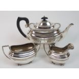 A three piece silver tea service by Hammond, Turner & Son, Birmingham 1931, of rounded rectangular