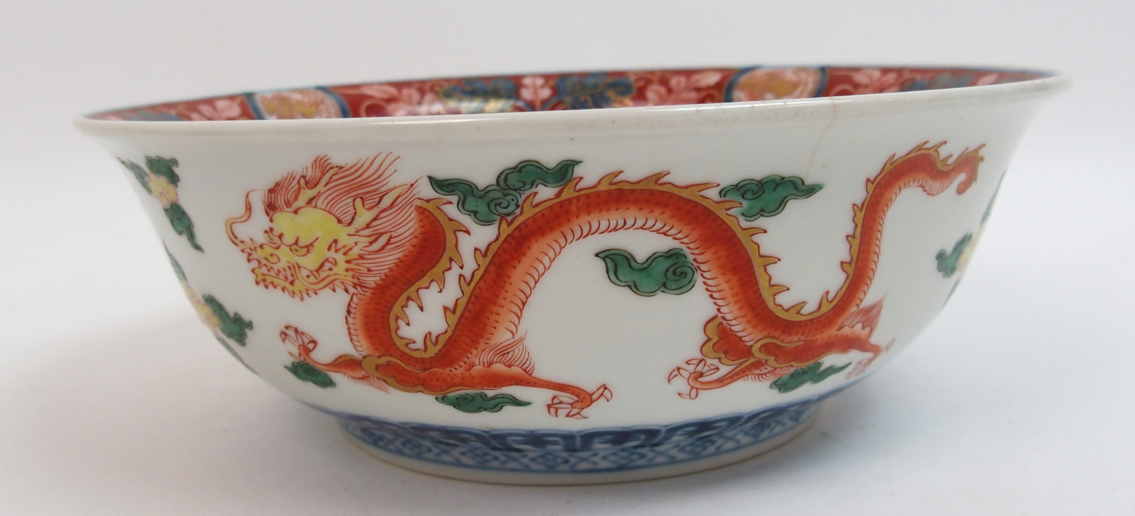 An Imari bowl painted with a kylin surrounded by gilt dragon roundels, diaper, trellis and cloud - Image 7 of 10