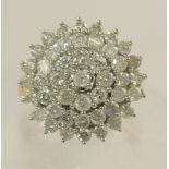 A 9ct gold diamond cluster ring estimated at approx 2cts, with clawed basket mount and yellow gold