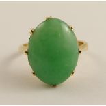 An 18ct gold Chinese green hardstone ring with pretty galleried mount finger size I (I for India)