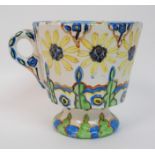 Jessie M King (1875-1949) A pottery mug hand painted with stylised floral and foliate decoration, in