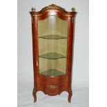 A reproduction serpentine glazed corner vitrine cabinet 172cm high x 73cm wide x 52cm deep