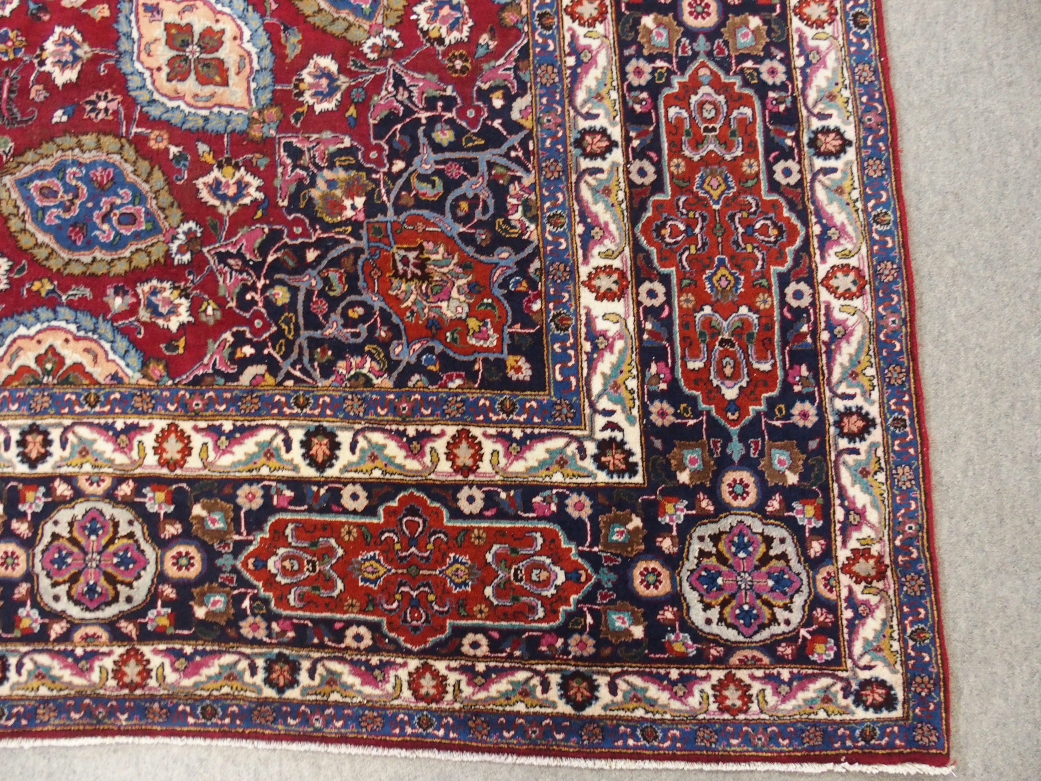 A red ground meshed rug with a blue central medallion and border, 370 x 294cm - Image 8 of 10