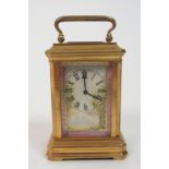 A Miniature French carriage clock the brass frame with painted porcelain panels depicting girls