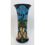 A Moorcroft Blue Rhapsody pattern vase the trumpet shaped vase decorated with blue poppies, designed