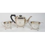 A three piece silver tea service by George Wish Limited, Sheffield 1933, of curving rectangular form