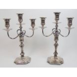 A pair of early 20th Century silver candelabra by Hawksworth, Eyre & Co., Limited, rubbed date