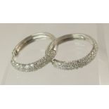 A pair of 9ct white gold diamond pave set earrings of an approximate estimated total of 0.75cts,