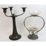 A Kayserzinn Art Nouveau pewter candlestick with stylised flower heads and foliage with three branch