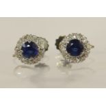 A pair of 9ct yellow and white gold sapphire and diamond earrings with screw backs for non-pierced