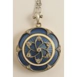 A Belle Epoque style guilloche enamel and diamond locket stamped 14 with an arrow to the interior,