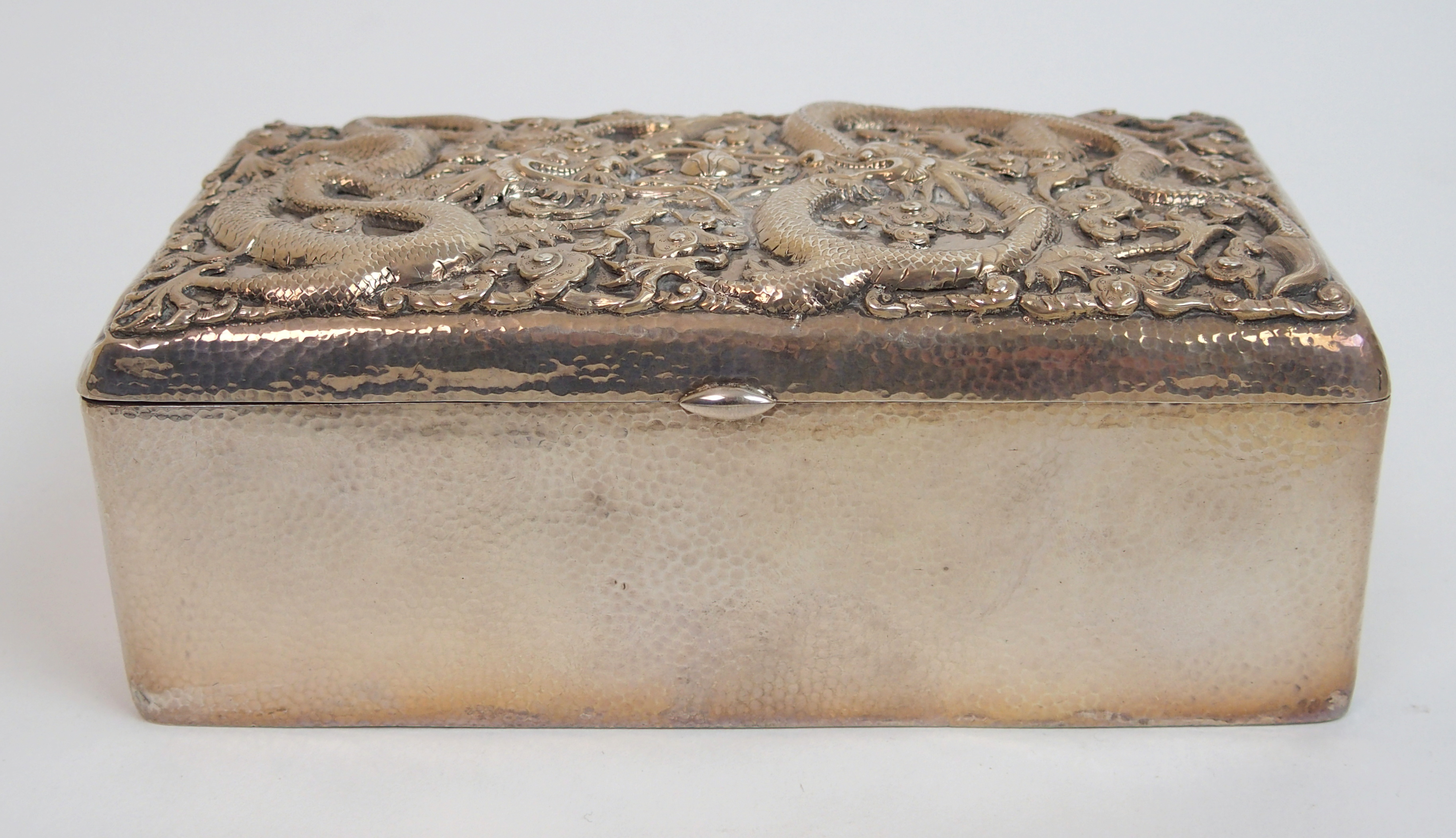 A Chinese silver hammered rectangular cigar box the hinged cover decorated with two facing dragons - Image 2 of 10