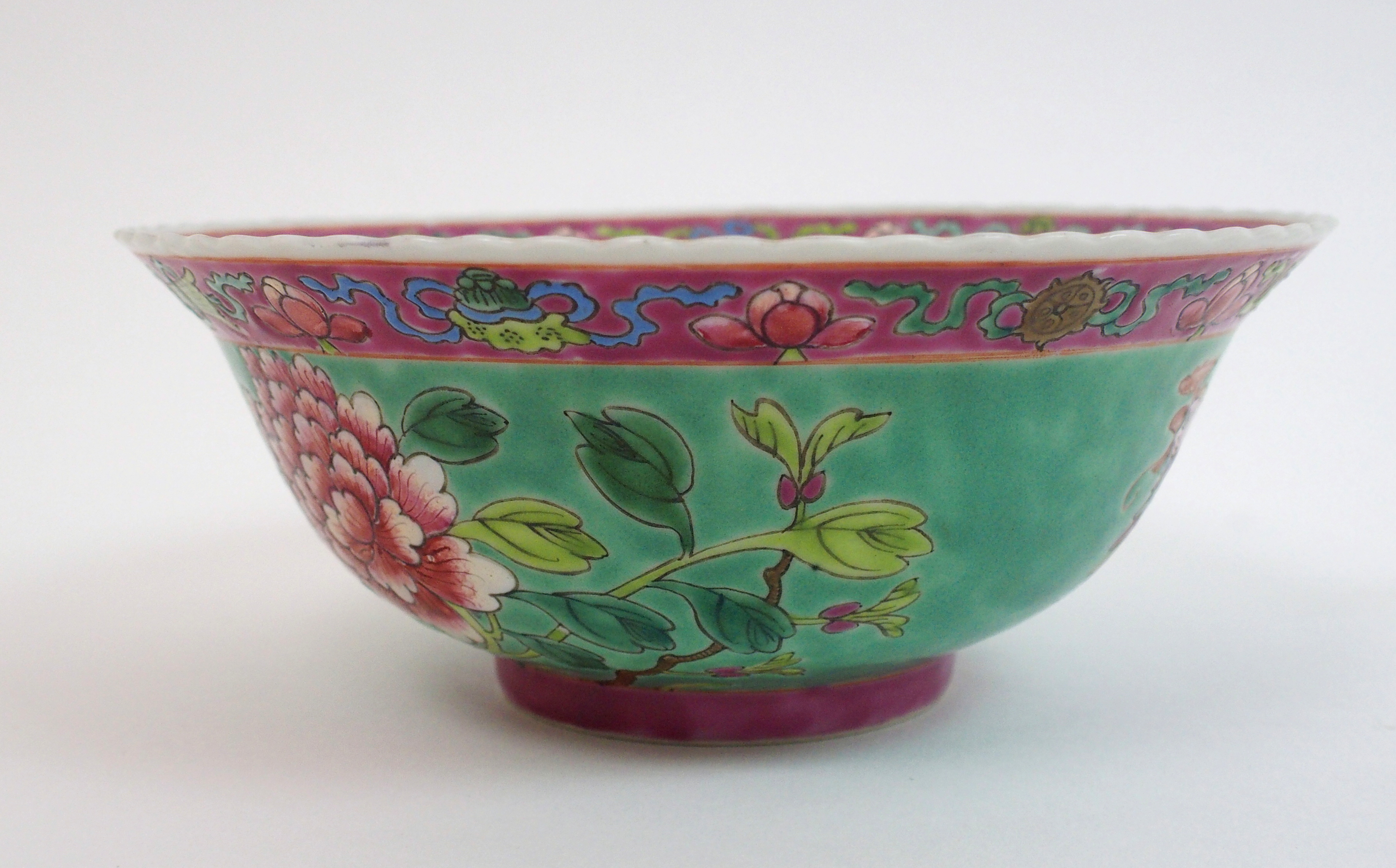 A Chinese bowl painted with an exotic bird, rockwork and chrysanthemum on a green ground, printed - Image 4 of 10