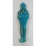 An Egyptian blue glazed ushabti figure holding fly whisks, unnamed, 10cm high