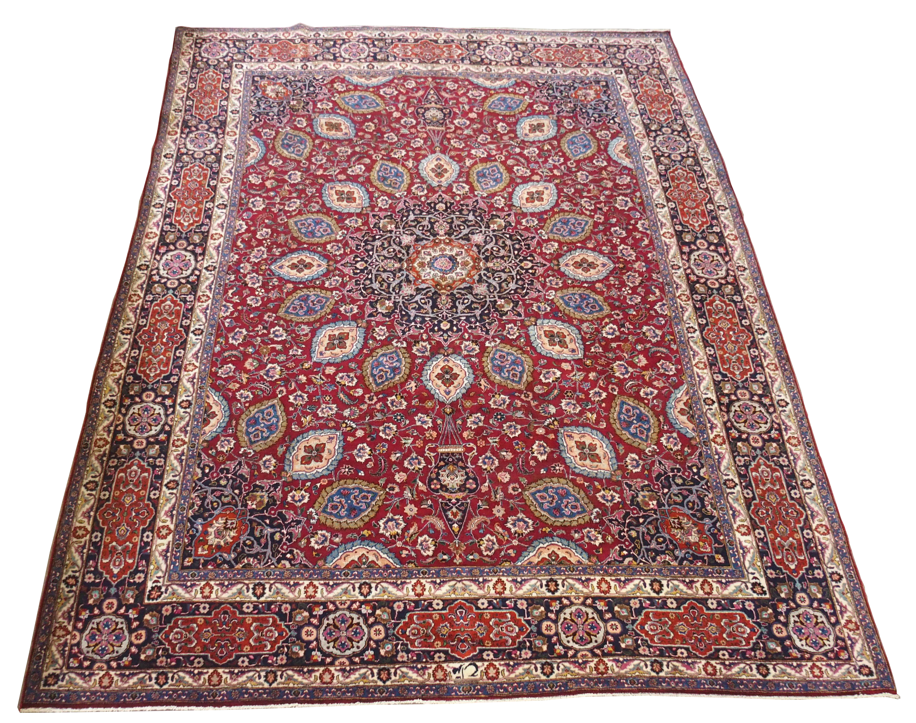 A red ground meshed rug with a blue central medallion and border, 370 x 294cm