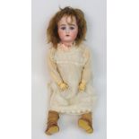 A large Kammer & Reinhardt "Mein Liebling" bisque-headed doll with open and close blue eyes, open