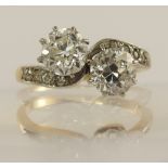 A classic old cut twin diamond ring on a twist the twin diamonds are approx 0.70cts each with