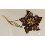 An 18ct gold plique a jour enamel and diamond brooch in the shape of a flower with stamens and