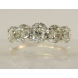 A five stone old cut diamond ring of approx 1.75ct in total the five old mine cuts are in white