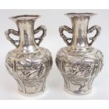 A pair of Chinese silver two-handled baluster vases decorated with chrysanthemum, 12cm high, dragons