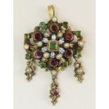 An Austro-Hungarian pendant brooch of gilded white metal set with garnets, emeralds and pearls