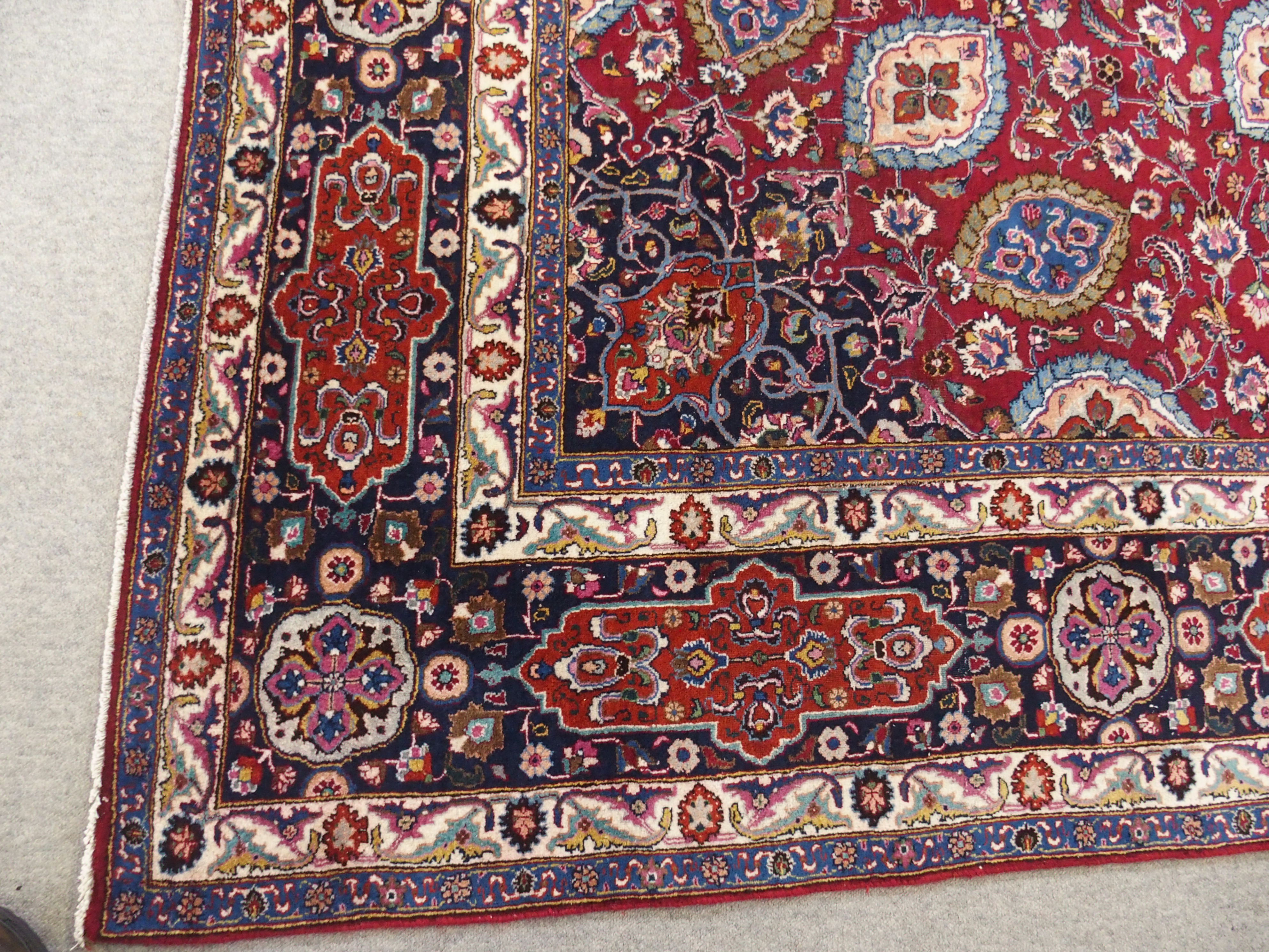 A red ground meshed rug with a blue central medallion and border, 370 x 294cm - Image 7 of 10