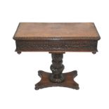 An Anglo-Indian rosewood card table the fold-over top with cabochon edge above a carved foliate