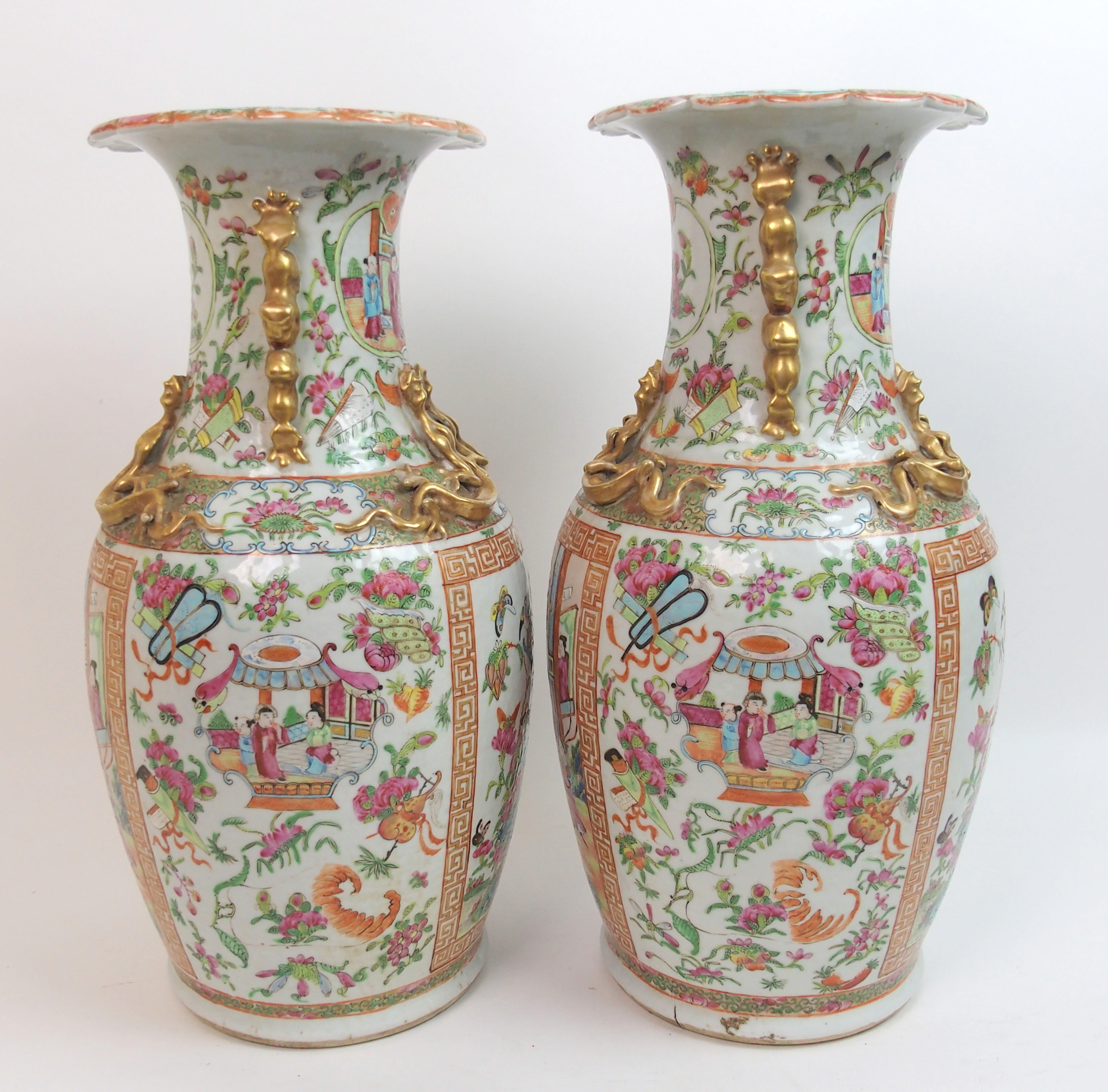 A pair of Canton famille rose baluster vases panted with large panels of mandarins holding court - Image 7 of 10