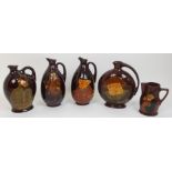 Five Royal Doulton Kingsware whisky flasks sporting Squire printed marks, 21cm high, Falstaff moon