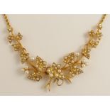 An Edwardian pearl set ivy leaf necklace made in bright yellow metal with rope chain to a box