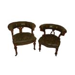 Two Victorian oak armchairs with leatherette button backs and arms and scroll seats on turned