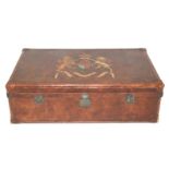 A 20th Century leather decorative trunk with painted coat of arms, hinged and nailed with carrying