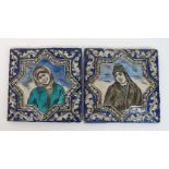 Two Persian relief moulded portrait tiles of women within star shaped medallions, 23 x 23 1/2cm (2)