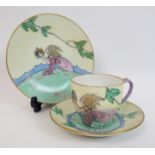 Elizabeth Mary Watt (1886-1954) A porcelain trio comprising a hand painted plate depicting a