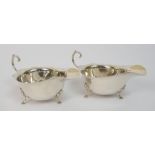 A pair of silver sauceboats by Wilson & Sharp, Birmingham 1913, with scalloped rims and open