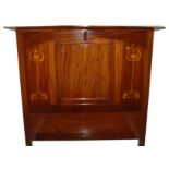 A Glasgow style mahogany single bed with inlaid foliage and pierced heart motifs, 120cm x 107cm wide