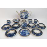 An early 19th Century English Willow pattern tea set comprising; a teapot with entwined handles with